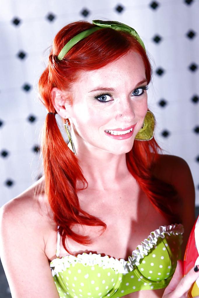 16P Dainty redhead babe Dani Jensen slipping off her lingerie