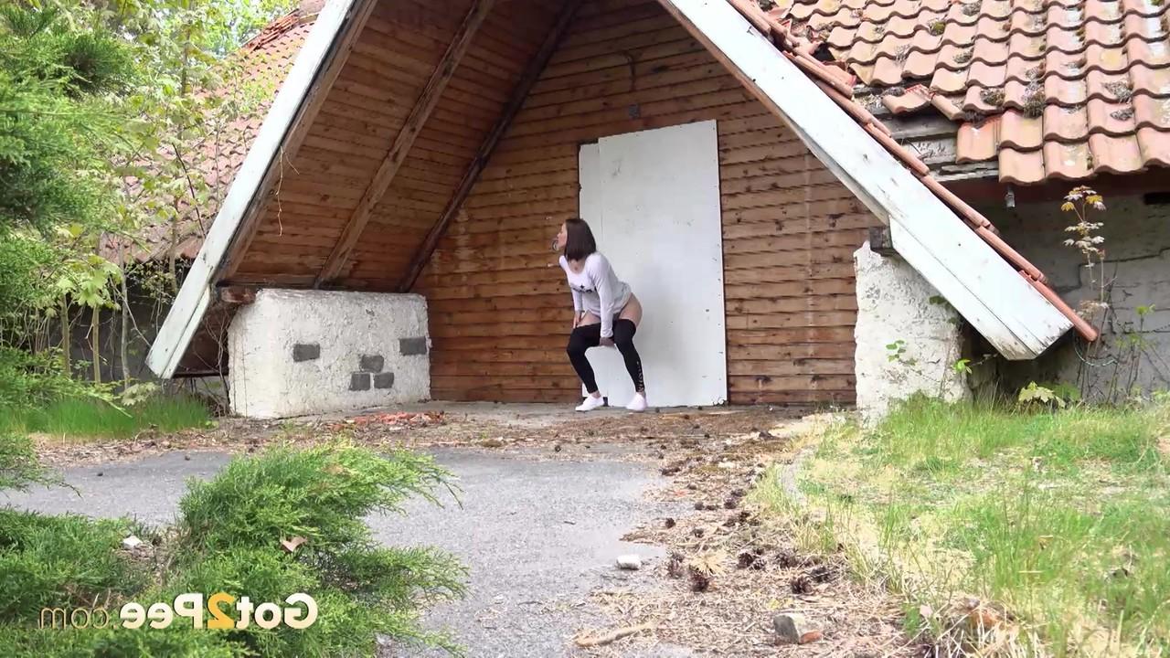 15P White girl Victoria Daniels pulls down black tights to pee outside of a chalet