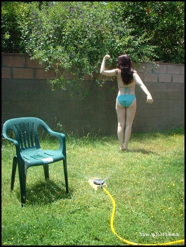 15P Pale chick Amber Lily exposes her ass while wetting herself with a garden hose