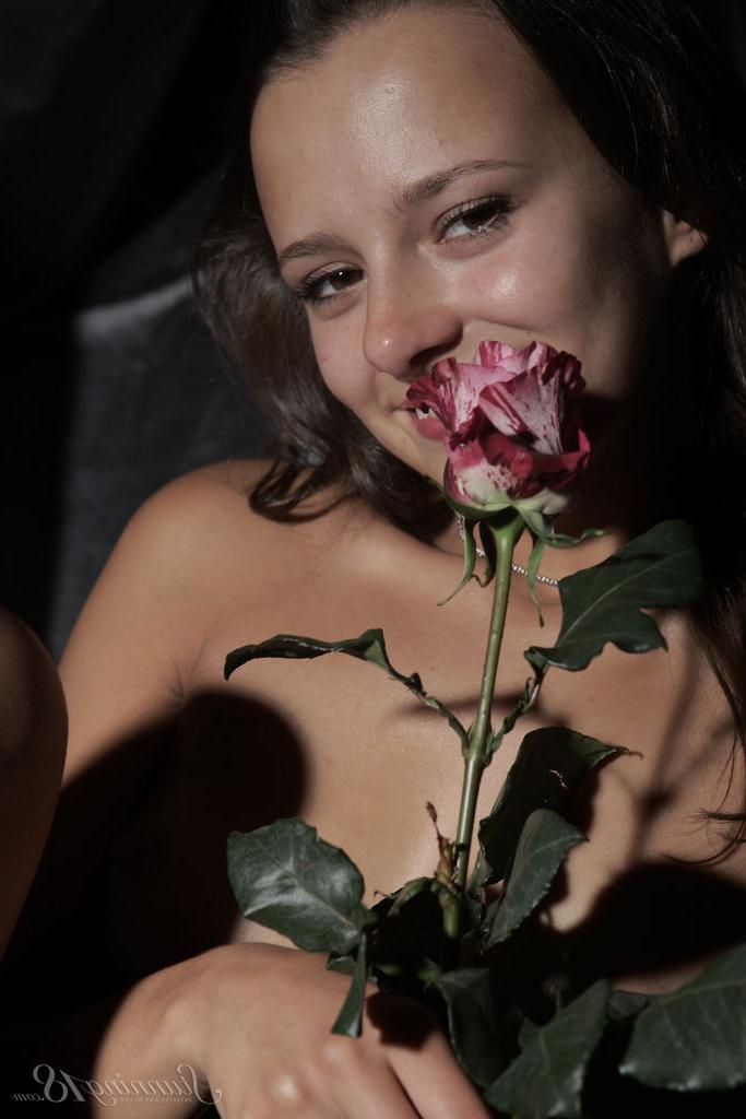 16P 18-year-old brunette Edison X holds a flower while posing in the nude