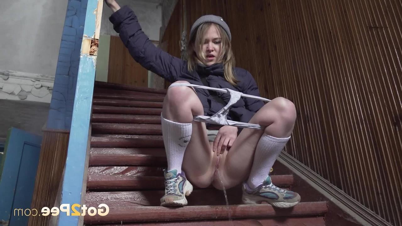 15P White girl Nastya squats on a flight of stairs while taking a piss