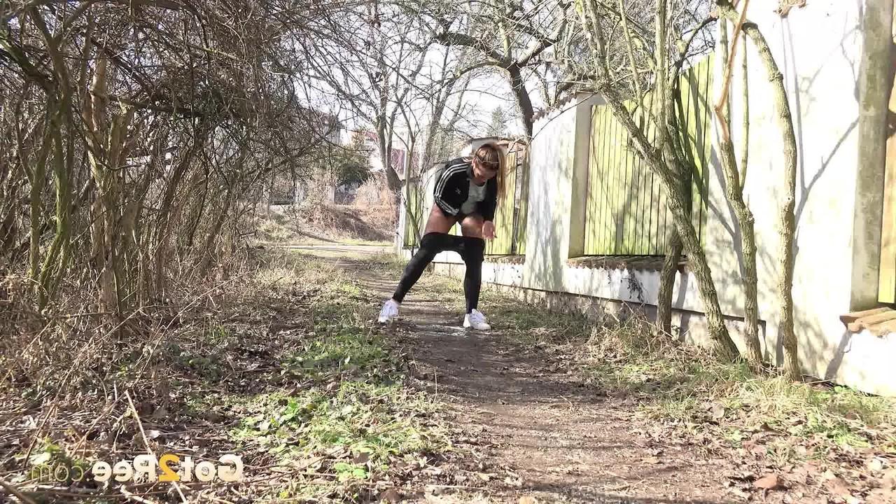 15P Naomi Bennet squats for a badly needed pee on a path behind a building