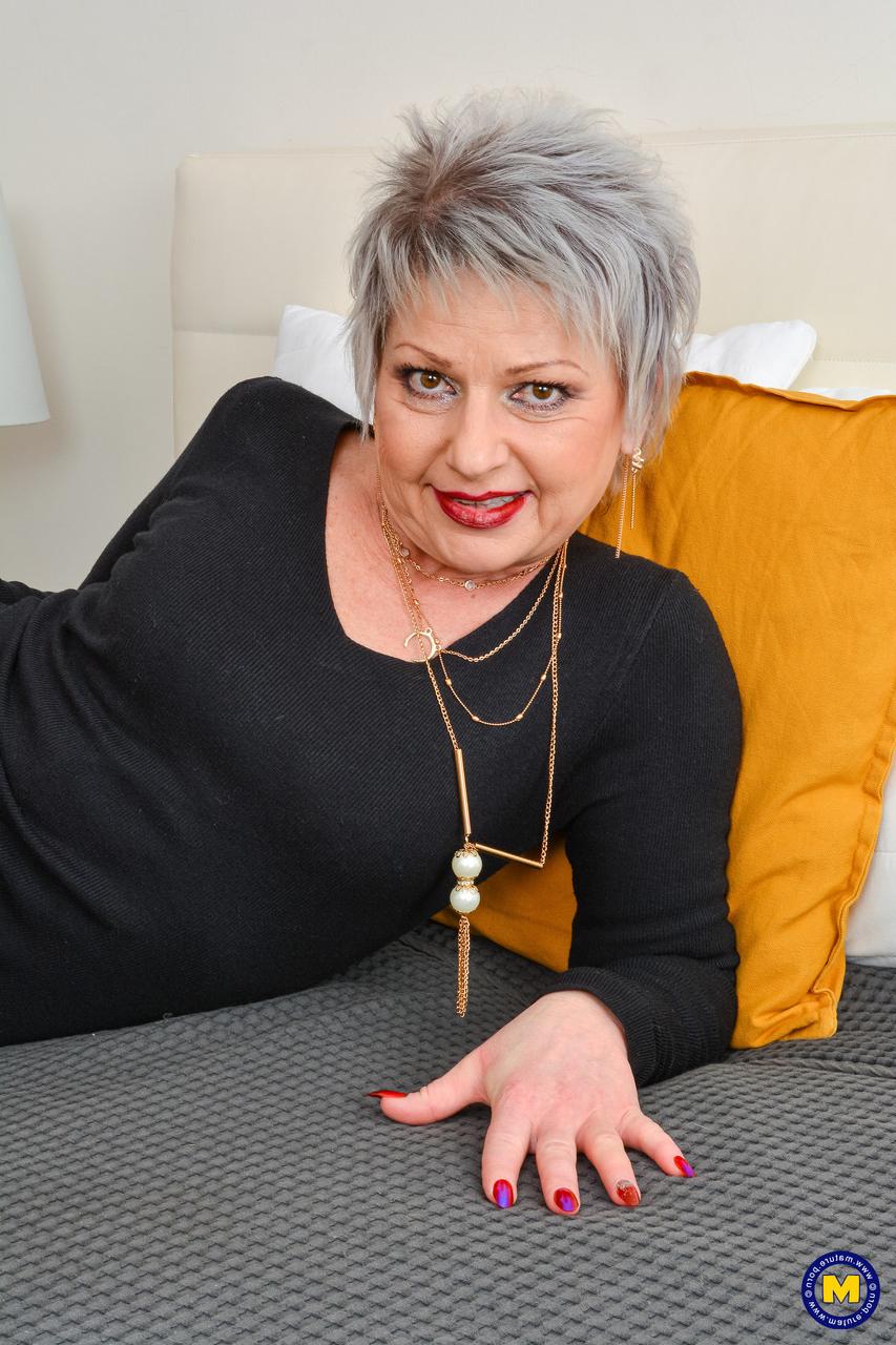 20P Short-haired GILF Lady X strips to her underwear & poses with her young lover