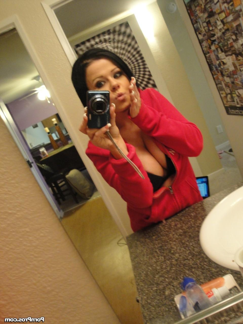 12P Black haired babe with massive jugs stripping and teasing with some nudes