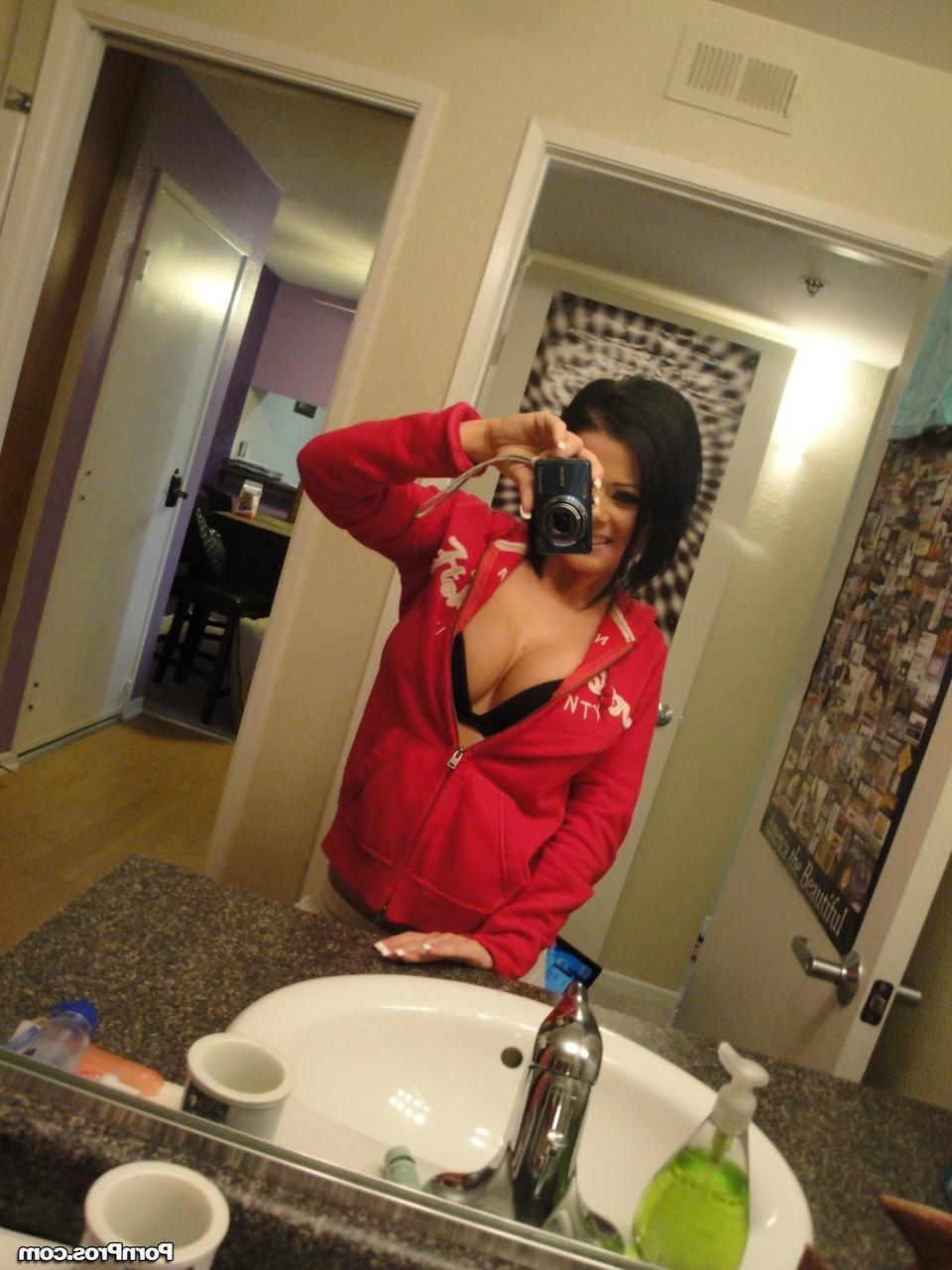 12P Black haired babe with massive jugs stripping and teasing with some nudes