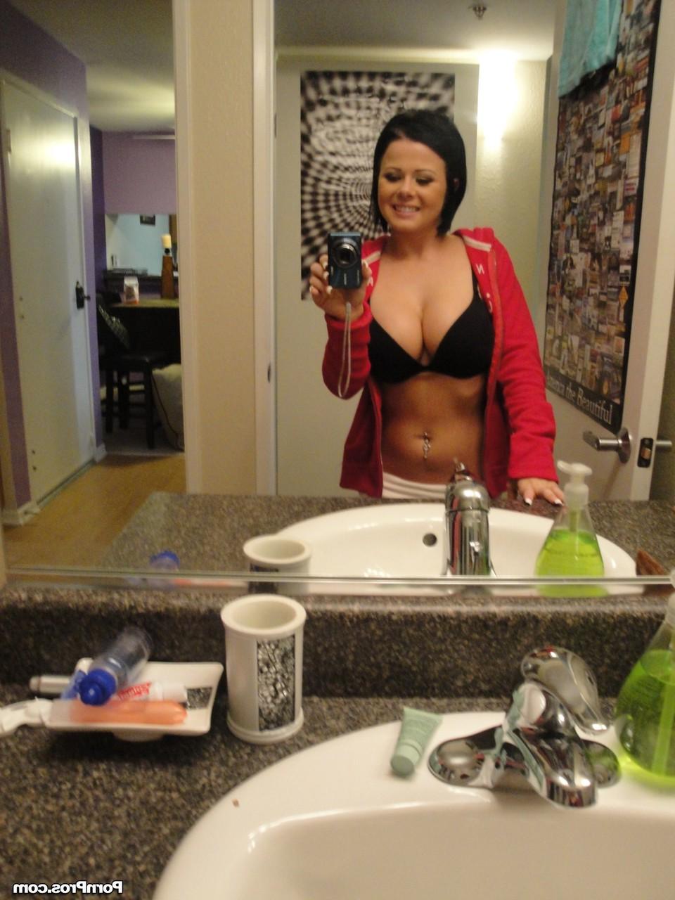 12P Black haired babe with massive jugs stripping and teasing with some nudes