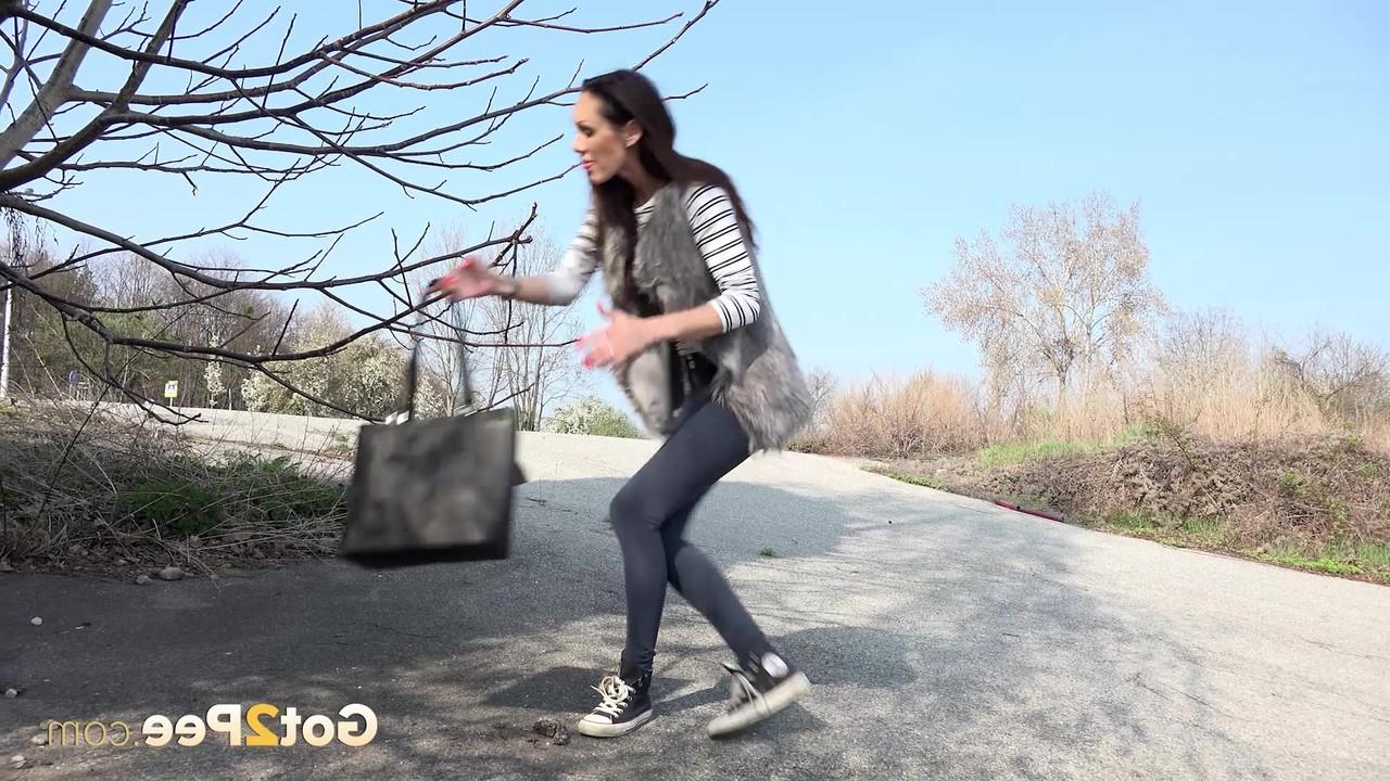15P Cynthia Vellons pulls down her leggings on the road for an urgent piss