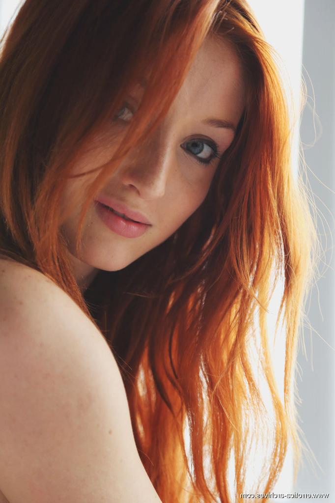 16P Pale redhead Micca strikes tempting poses while totally naked on her bedsheets