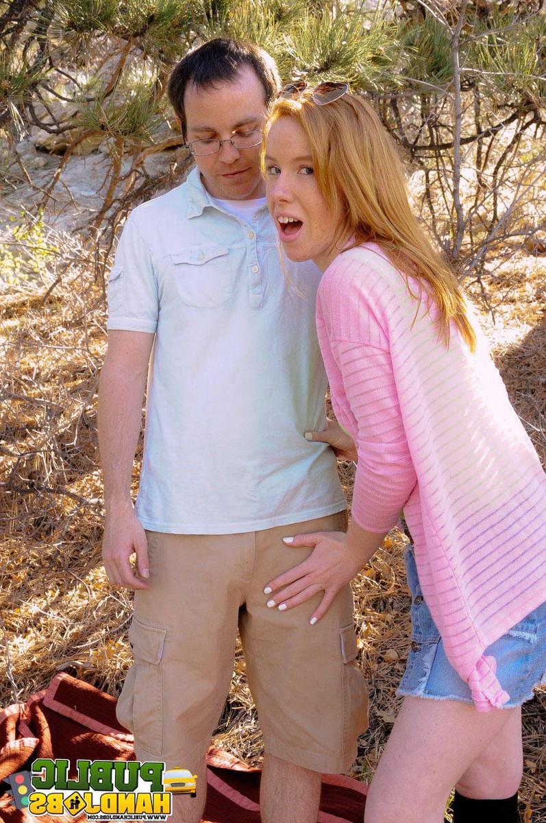 20P Naughty redhead Kierra Wilde gives her boyfriend an outdoor handjob