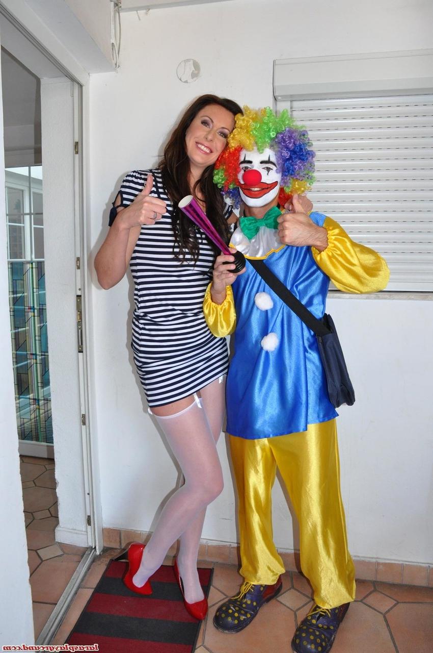 20P Tall MILF Lara strips for a clown before taking his knob deep on the floor