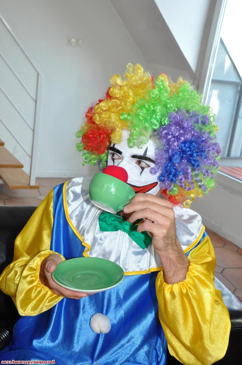 20P Tall MILF Lara strips for a clown before taking his knob deep on the floor