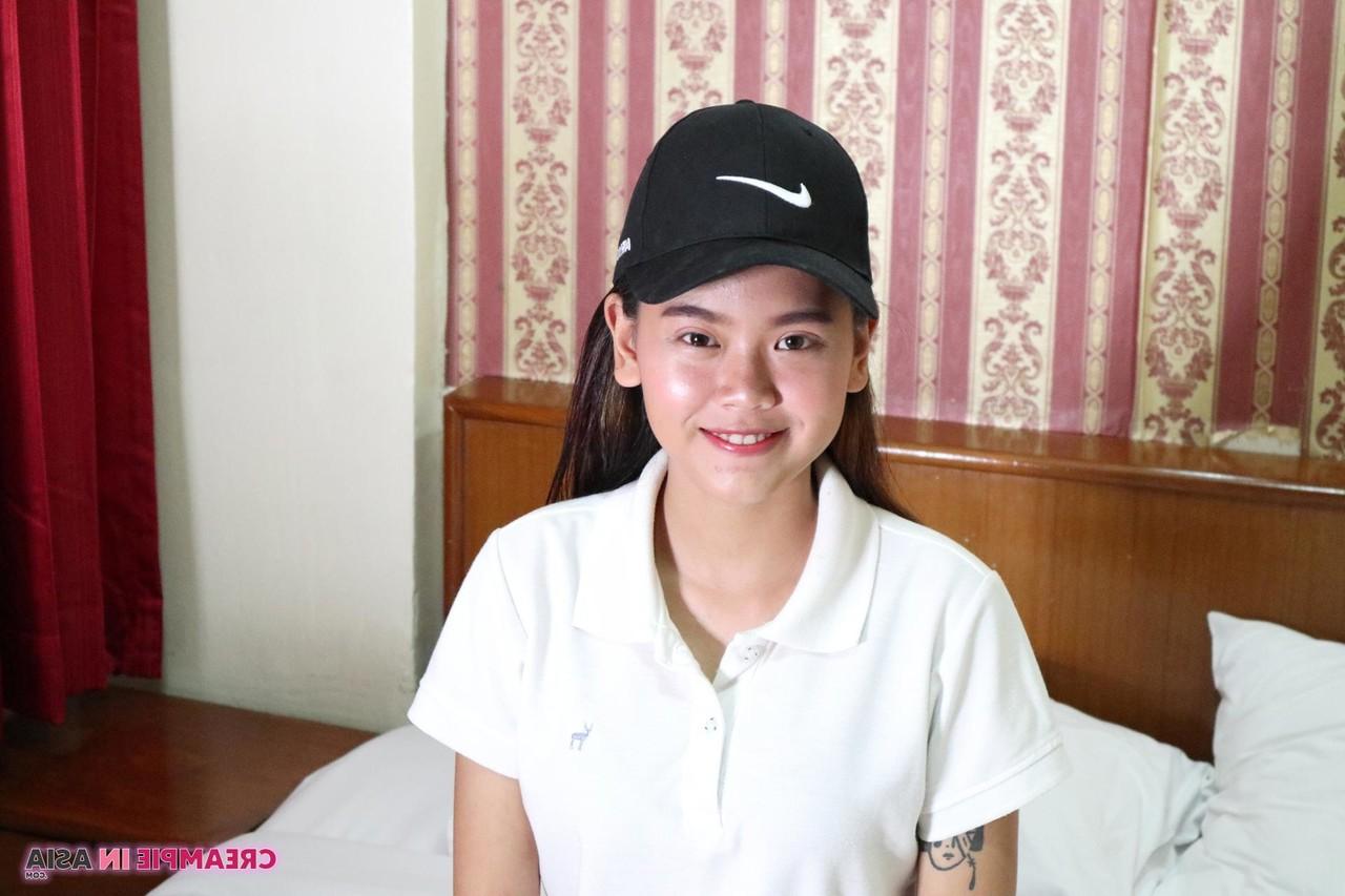 20P Pretty Asian girl Sprite unveils her wonderful tits and her hairy pussy