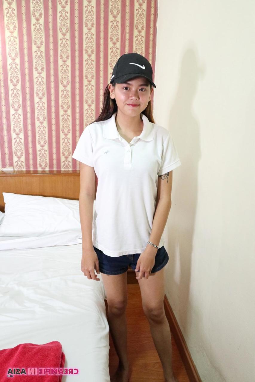 20P Pretty Asian girl Sprite unveils her wonderful tits and her hairy pussy