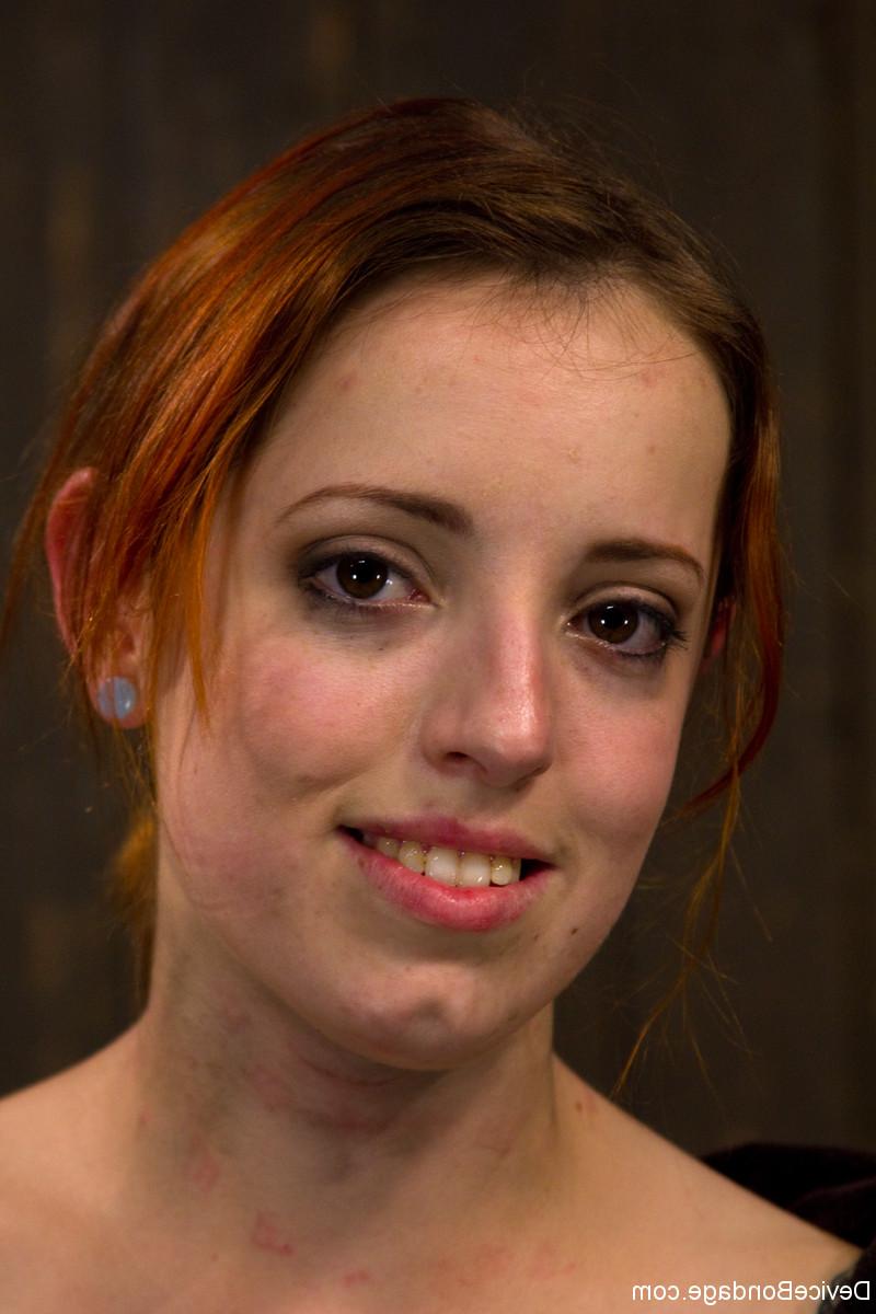 17P Redhead female Sloane Soleil suffers through a painful bondage session