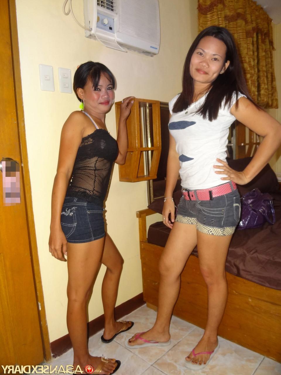 15P Asian girls Irish and Leann get completely naked atop a bed