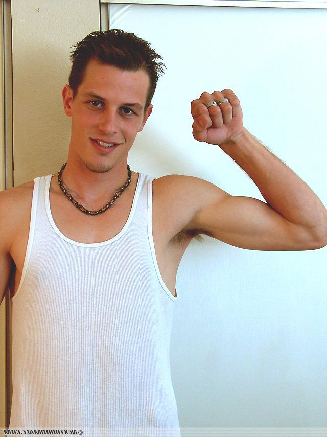 20P Slim brunette twink Dan removes his shirt and masturbates on the sofa