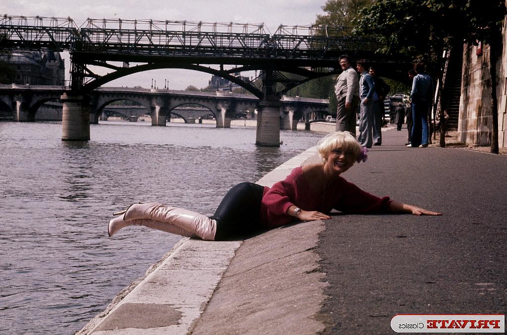 13P Blonde chick with a seventies hair cut sticks a bottle in her snatch