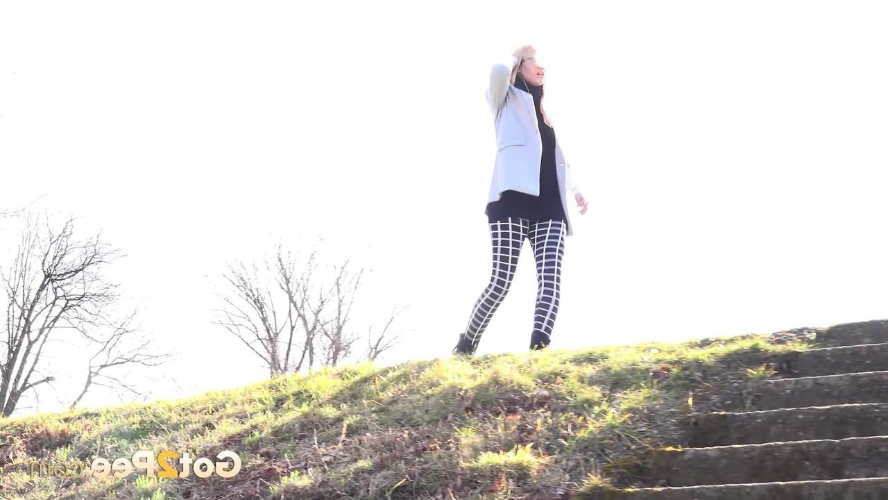 15P Blonde chick Delphine pulls down her leggings for a pee in a public place