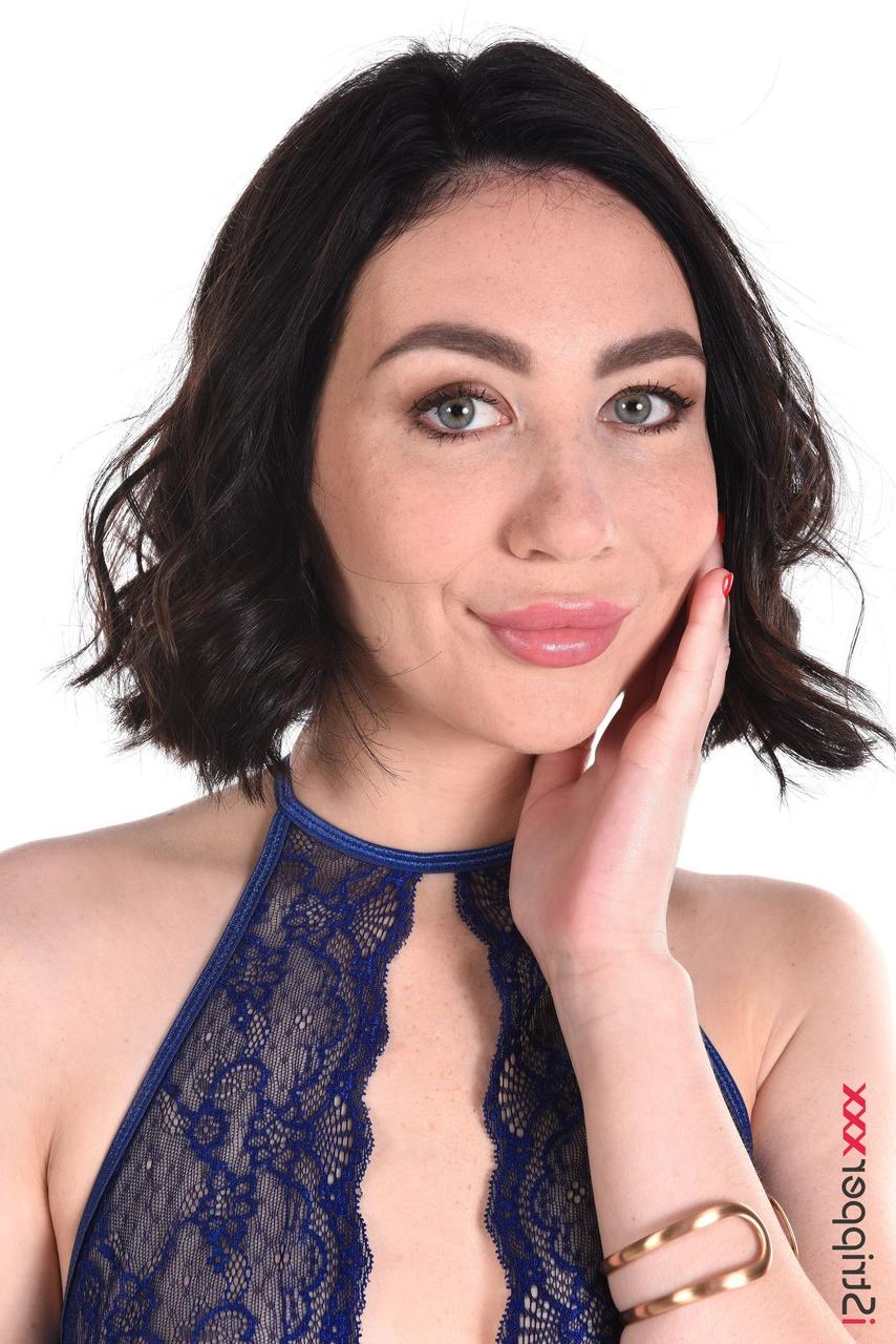 15P Sexy brunette Vivian Grace works free of lingerie before toying her pussy