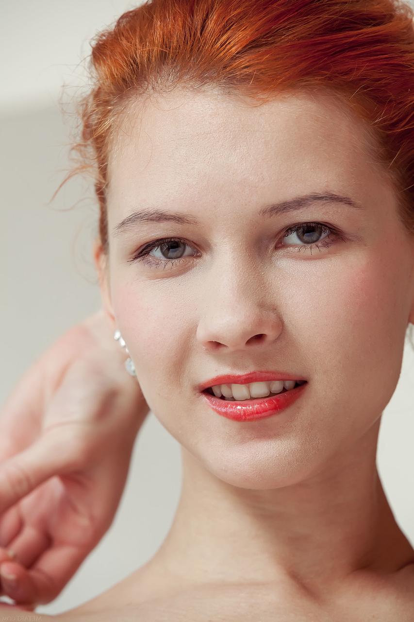 20P Redheaded babe with a pretty ass Ambre unveils her slim body in a solo