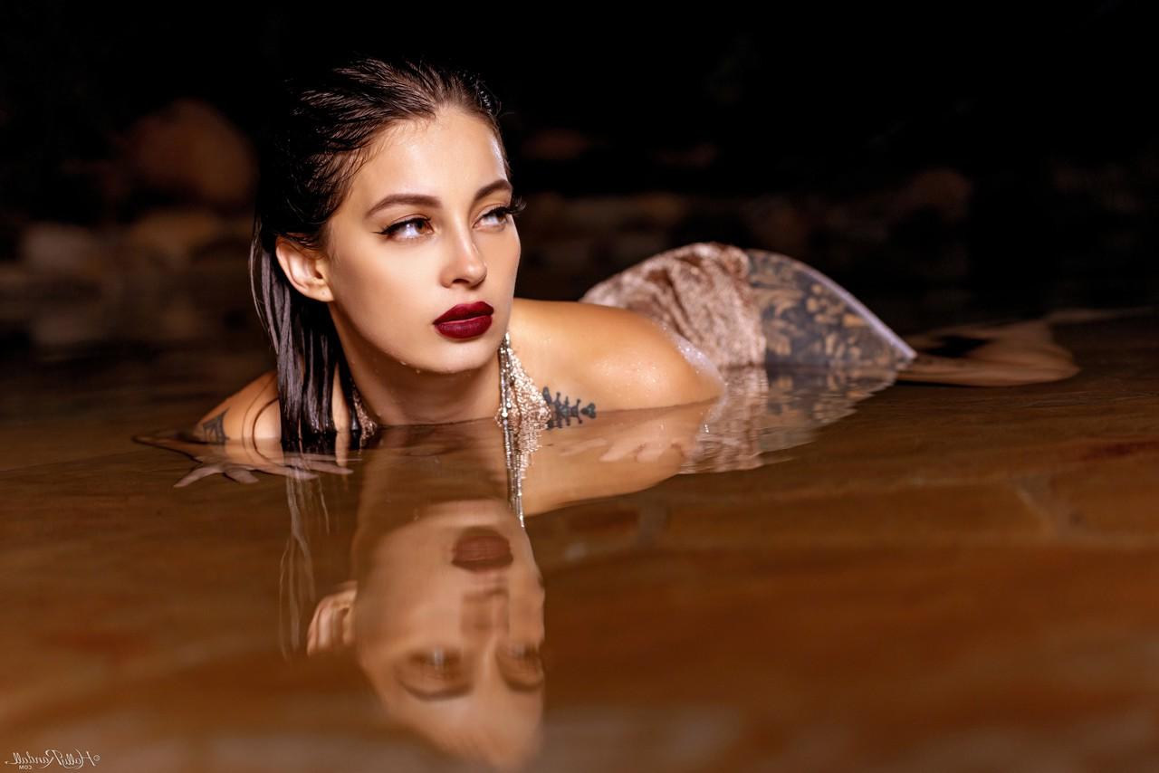 20P Inked honey Maddy May reveals her tits and hot ass in shallow water