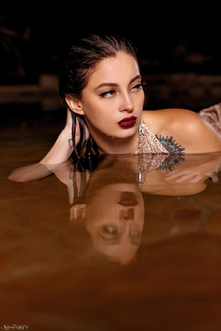 20P Inked honey Maddy May reveals her tits and hot ass in shallow water