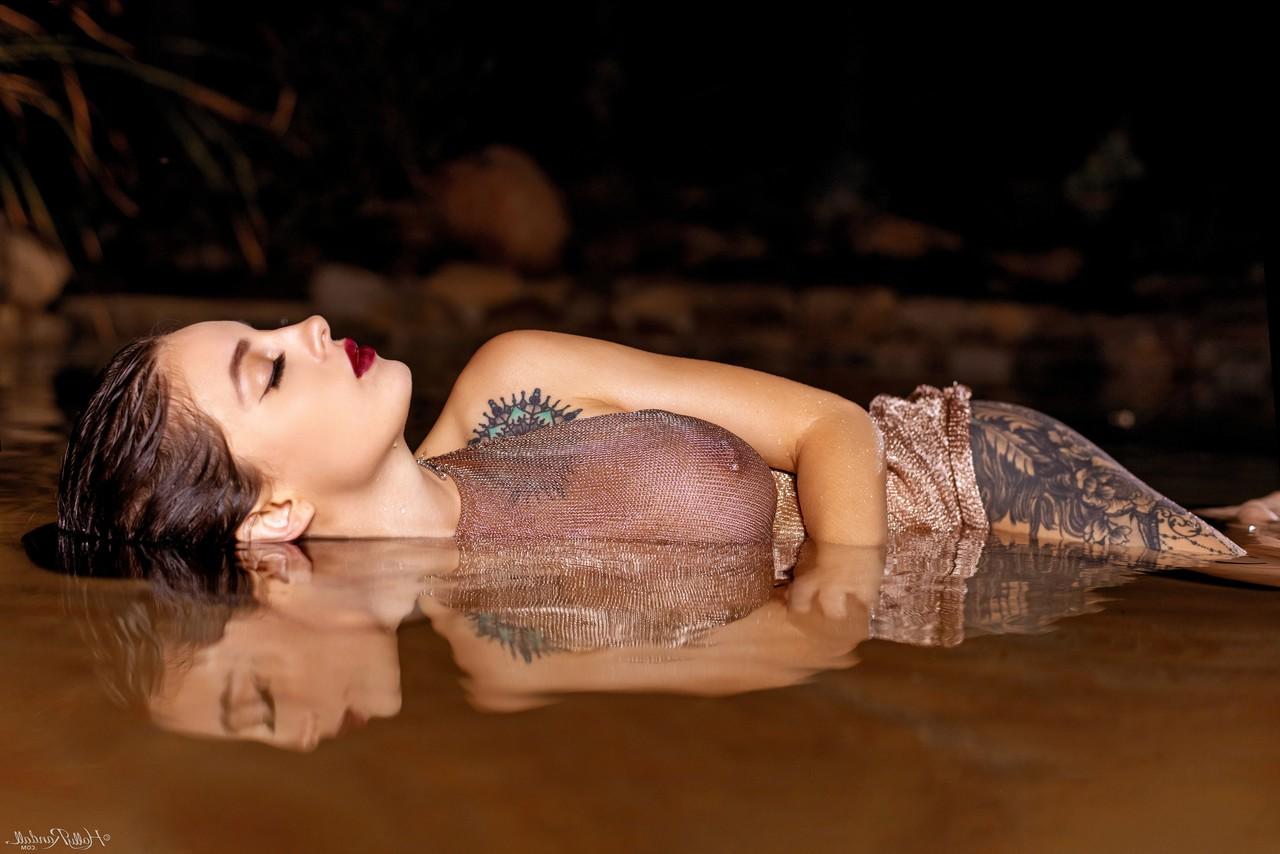 20P Inked honey Maddy May reveals her tits and hot ass in shallow water