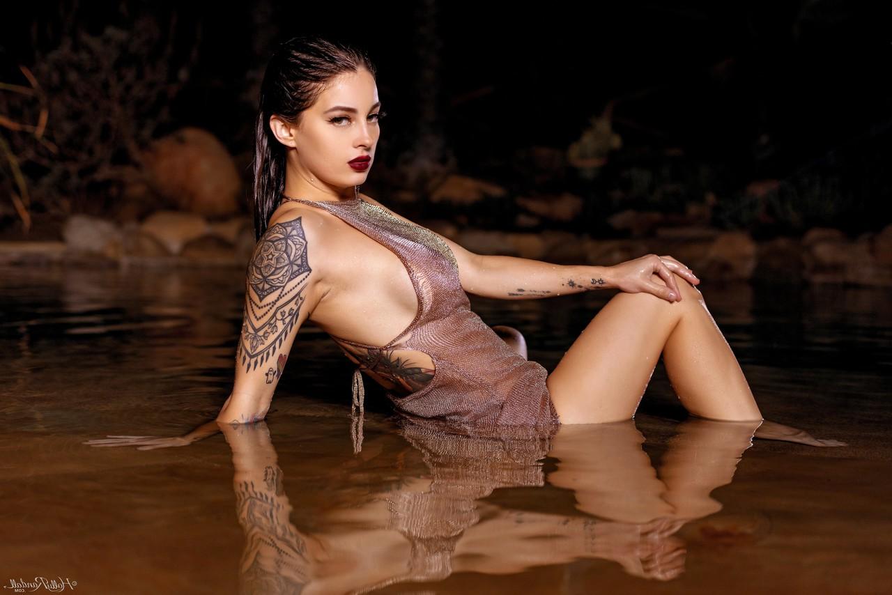 20P Inked honey Maddy May reveals her tits and hot ass in shallow water