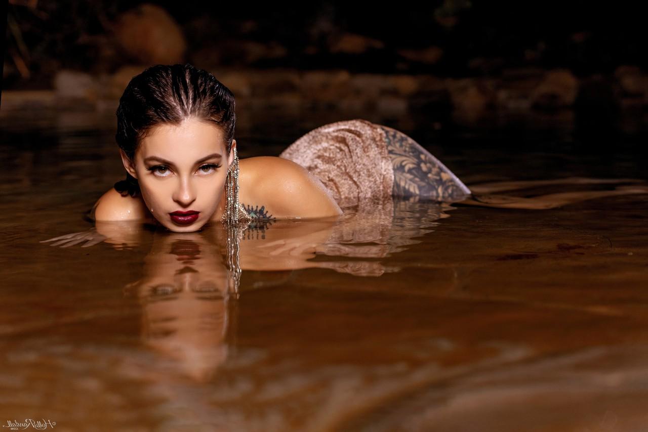 20P Inked honey Maddy May reveals her tits and hot ass in shallow water