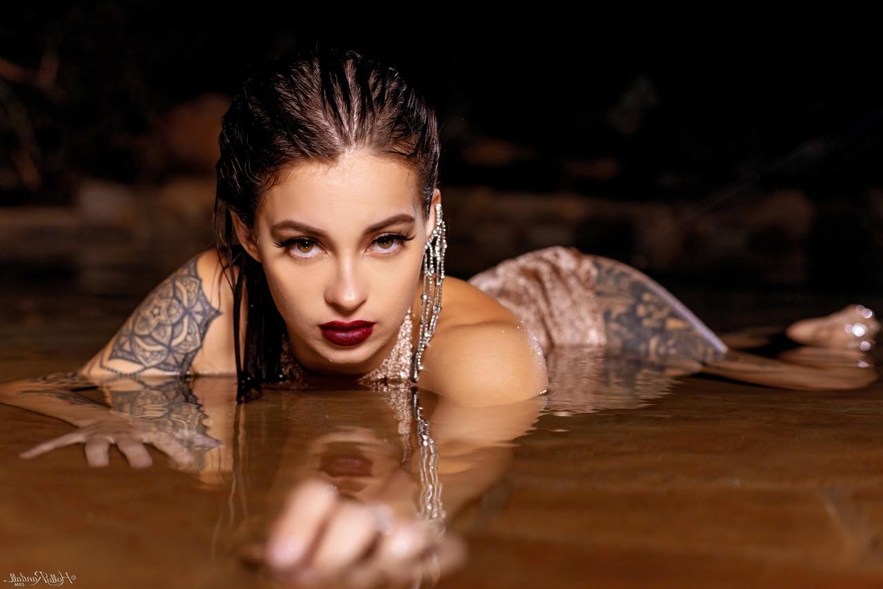 20P Inked honey Maddy May reveals her tits and hot ass in shallow water