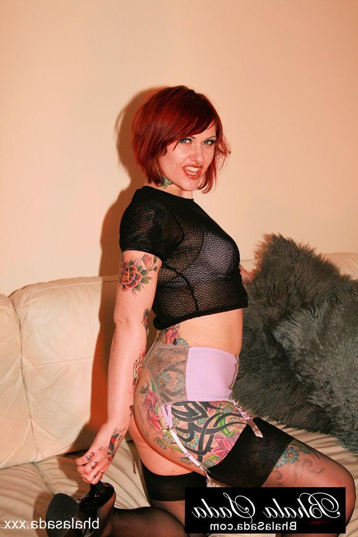 15P Slutty redheaded MILF showing off her hot inked body in her lingerie
