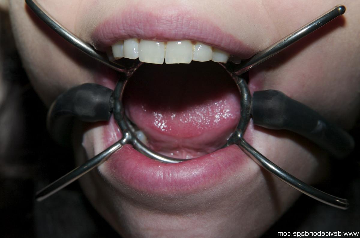 17P Young sub Kristine restrained with chains for punishment in metal bondage BDSM