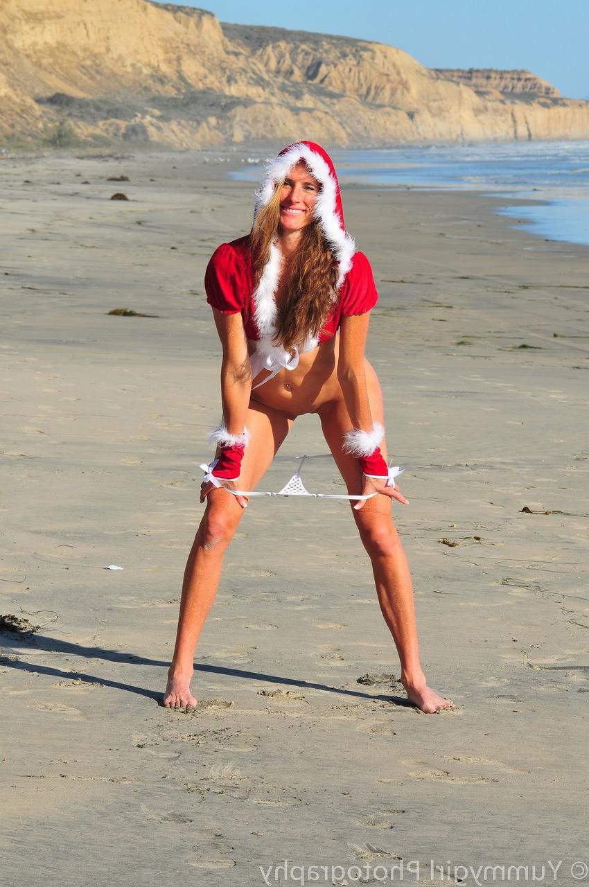 20P Sexy babe Sofie Marie posing in her provocative Christmas outfit on the beach