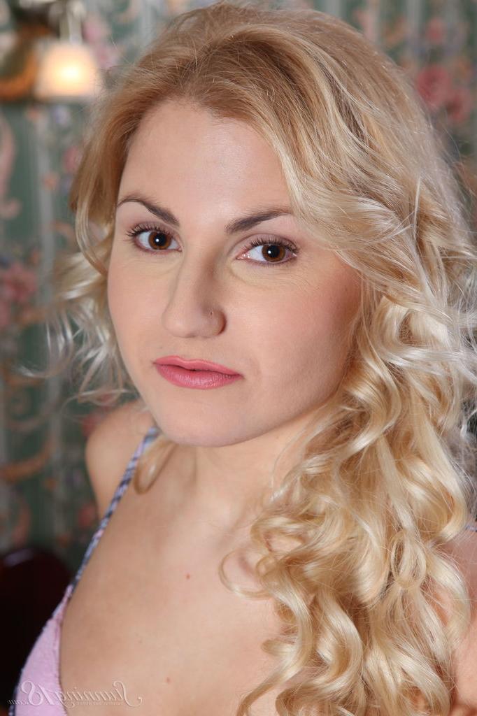 16P 18-year-old blonde Leona S gets completely naked upon her bed