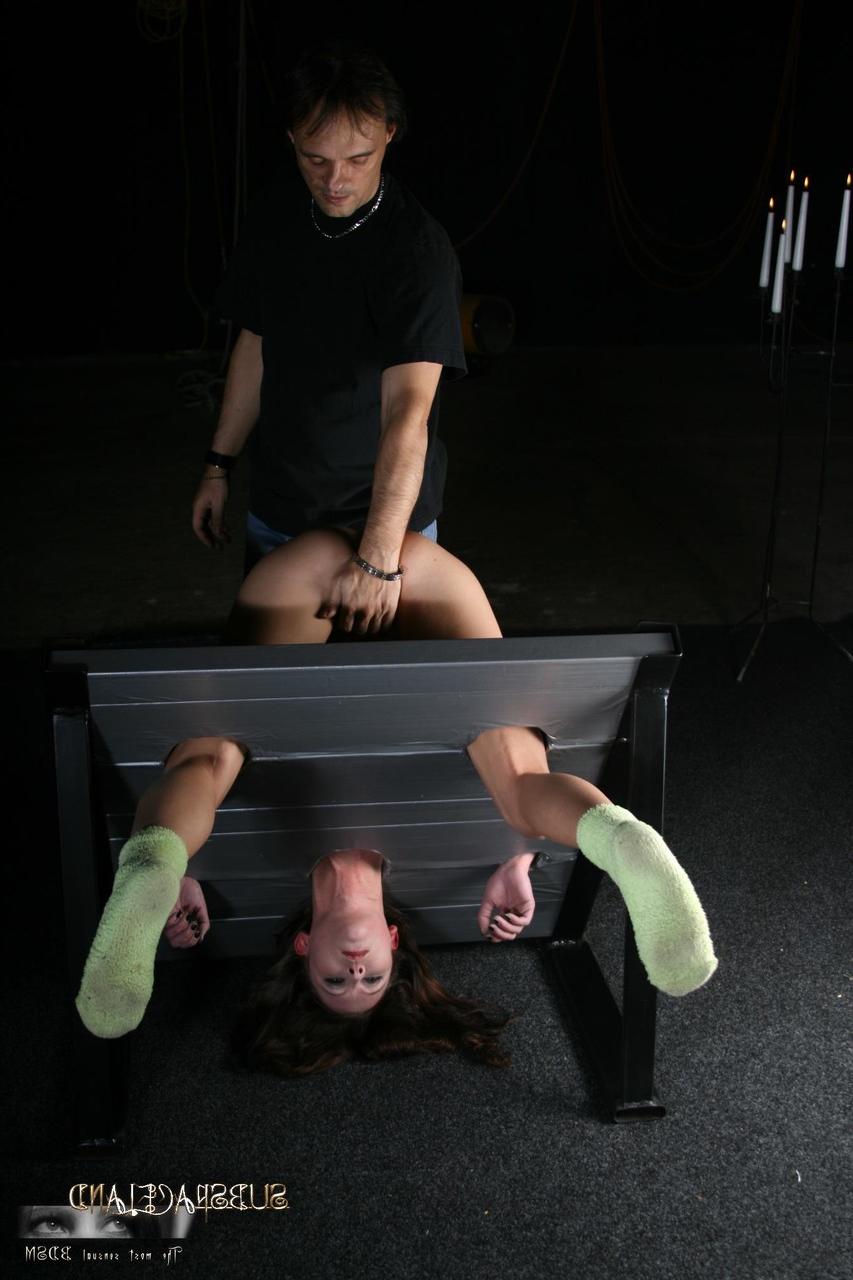 20P Slim brunette Goldie gets punished while in the stocks & suspended in bondage