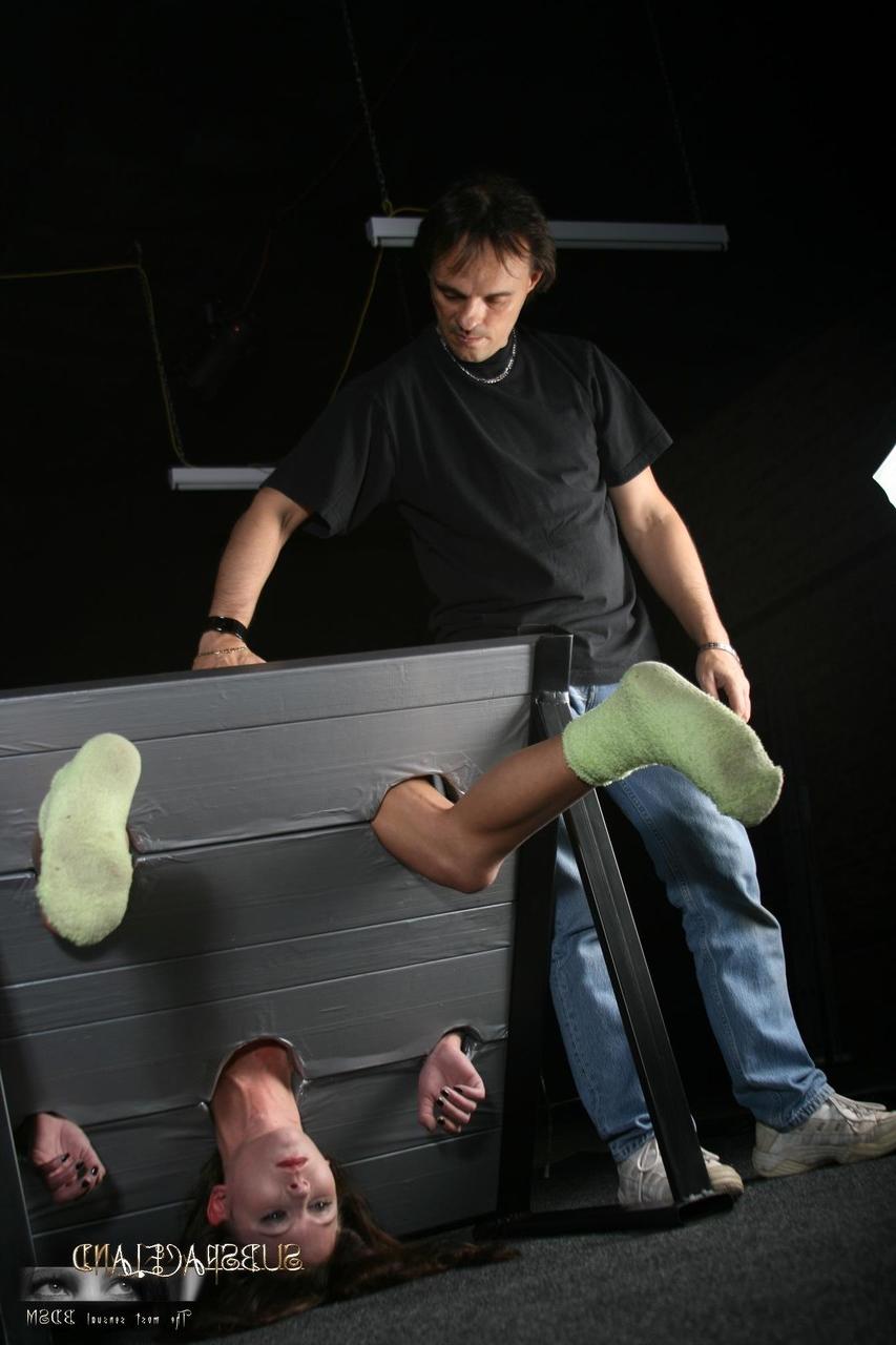 20P Slim brunette Goldie gets punished while in the stocks & suspended in bondage