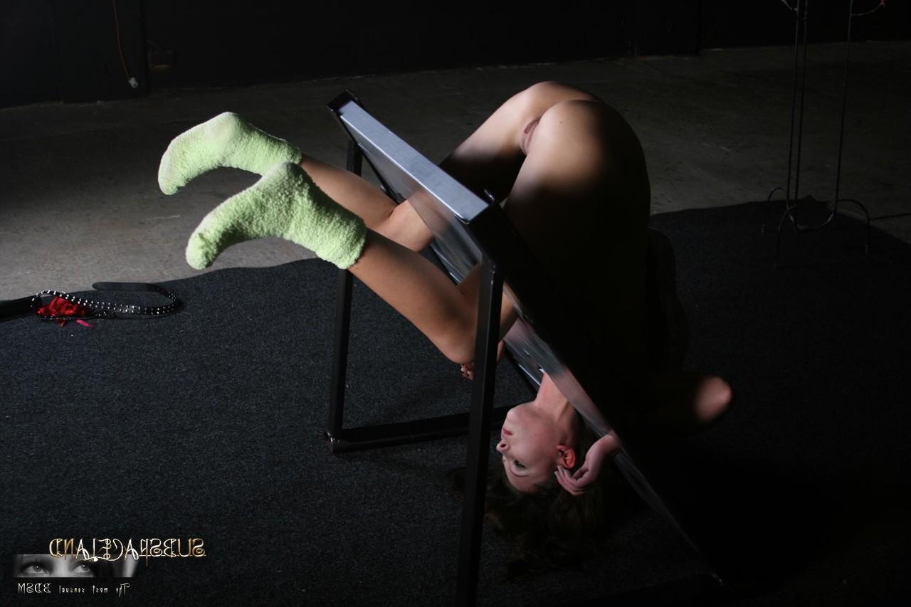 20P Slim brunette Goldie gets punished while in the stocks & suspended in bondage