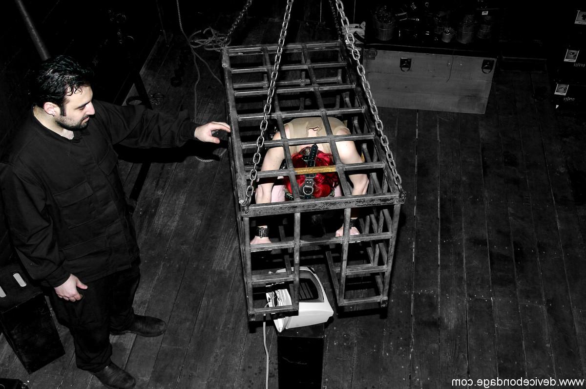 17P Redheaded slave Arachnia Webb gets tormented while locked in a cage