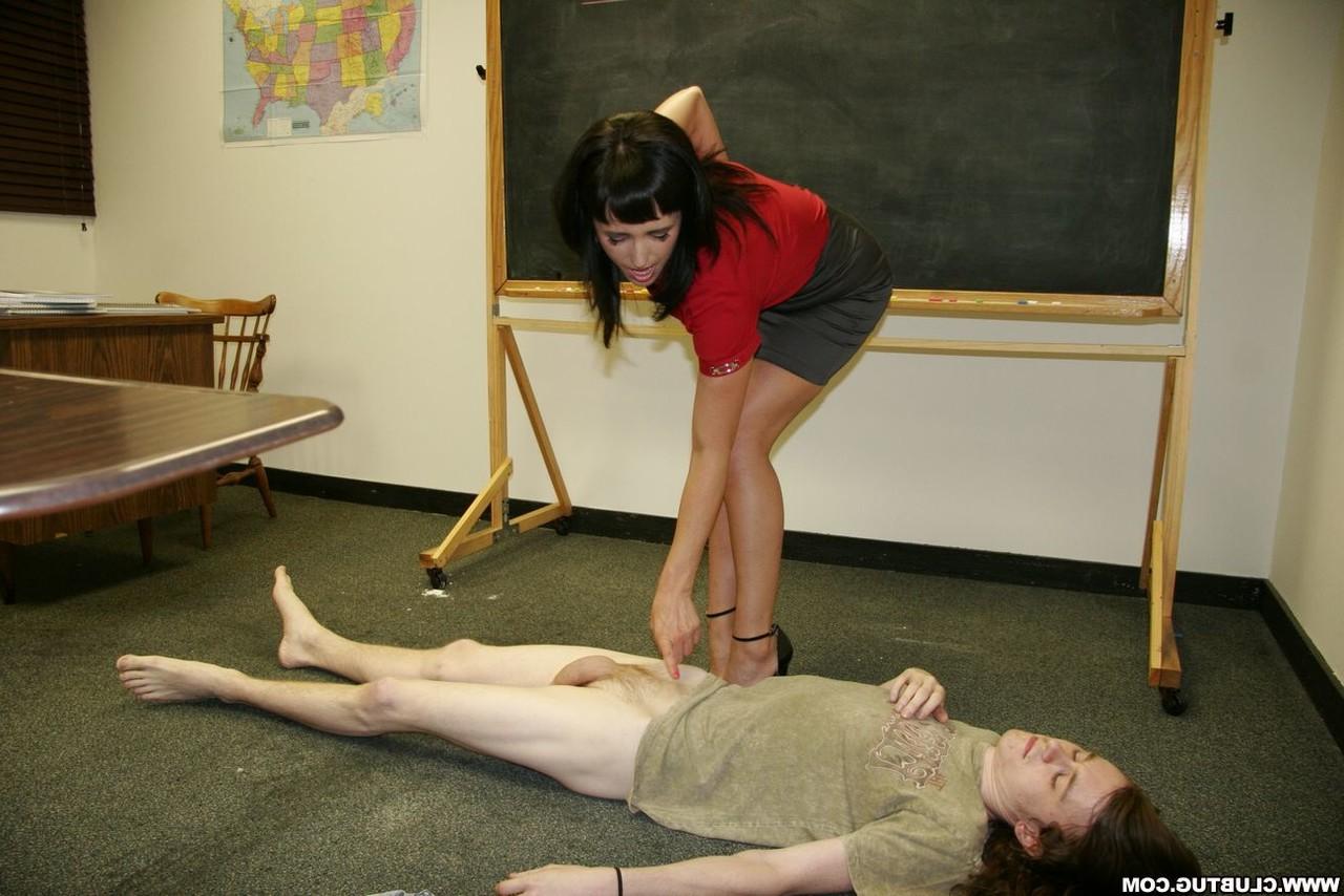 12P Dark haired teacher Dixie Comet tramples a student's dick before a handjob