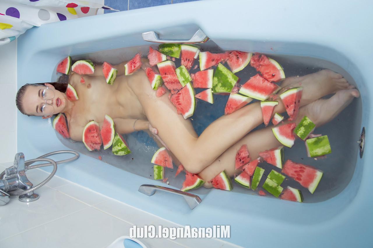16P Hot babe with glasses Milena Angel rubs her cunt while eating a watermelon