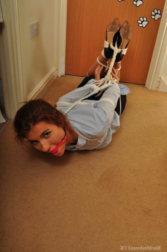 16P Redheaded security lady is left alone after being ball gagged and tied up