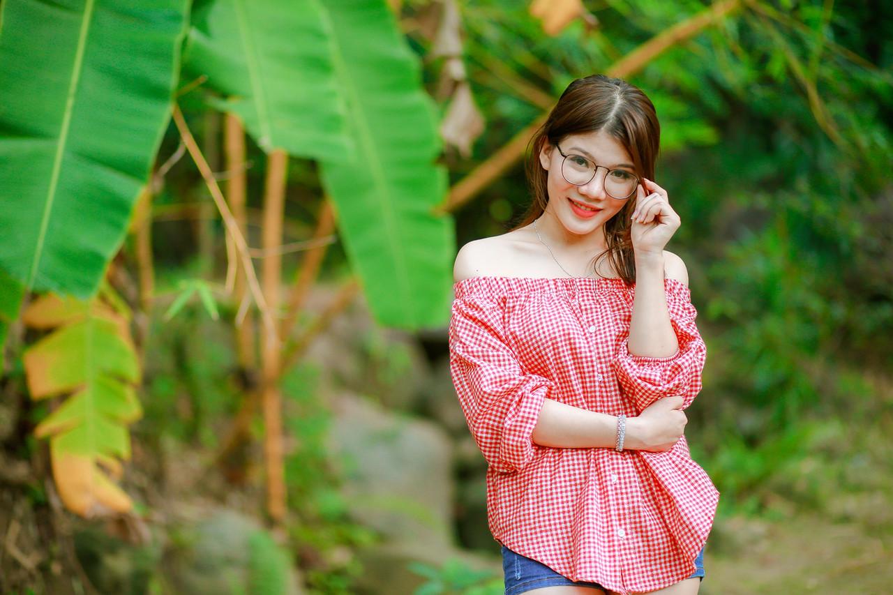 20P Pretty Asian girl with eyeglasses posing in her hot outfit in nature