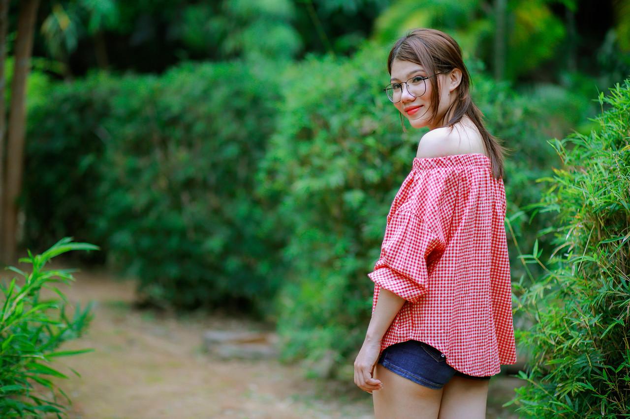 20P Pretty Asian girl with eyeglasses posing in her hot outfit in nature