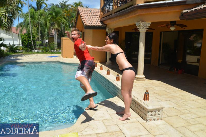 12P Brunette chick Riley Grey pushes a guy into the pool while seducing him