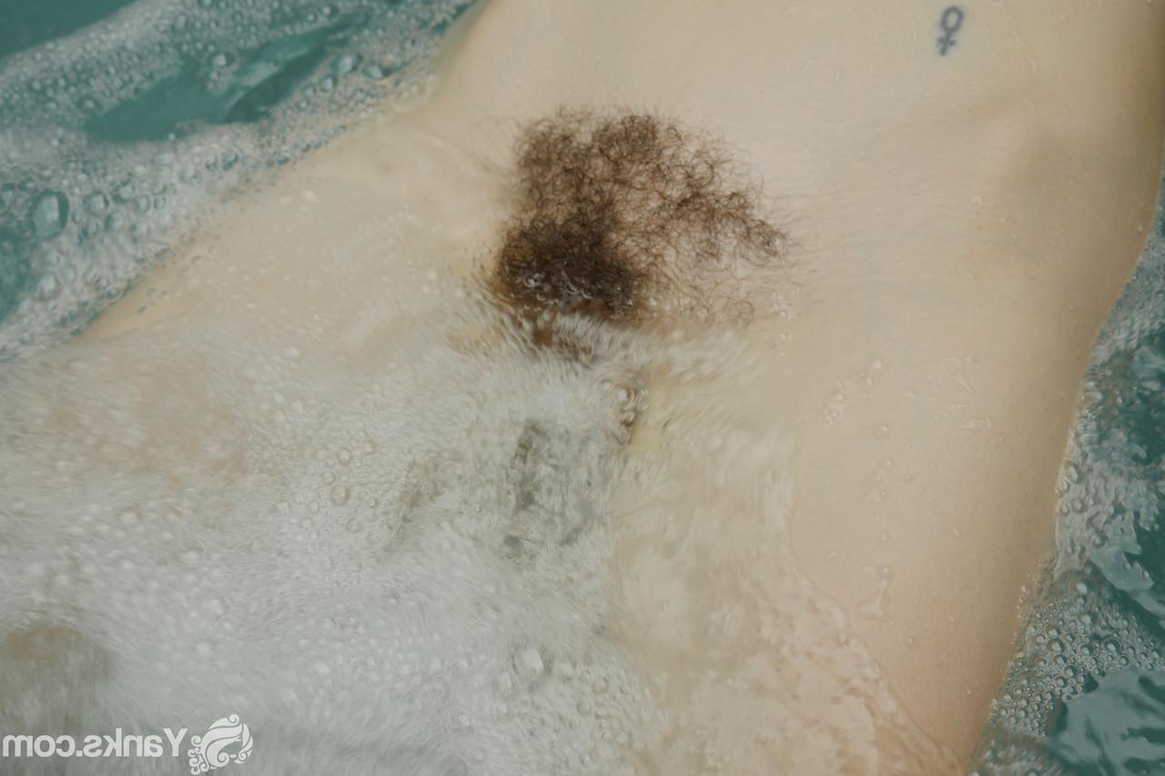 15P First timer Lilith Wilder rubs her muff while totally naked in a hot tub