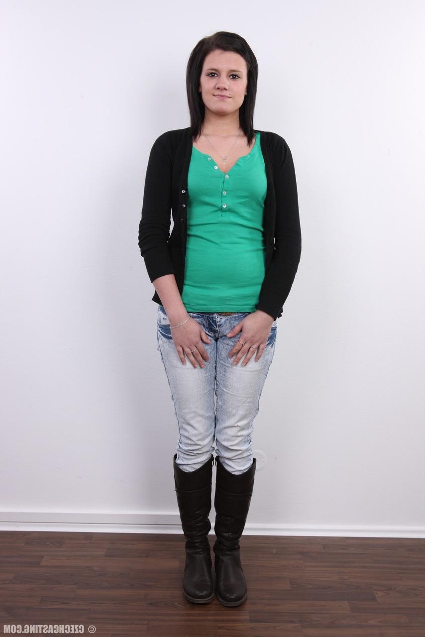 20P Cute brunette Lucie stands fully clothed before getting bare naked