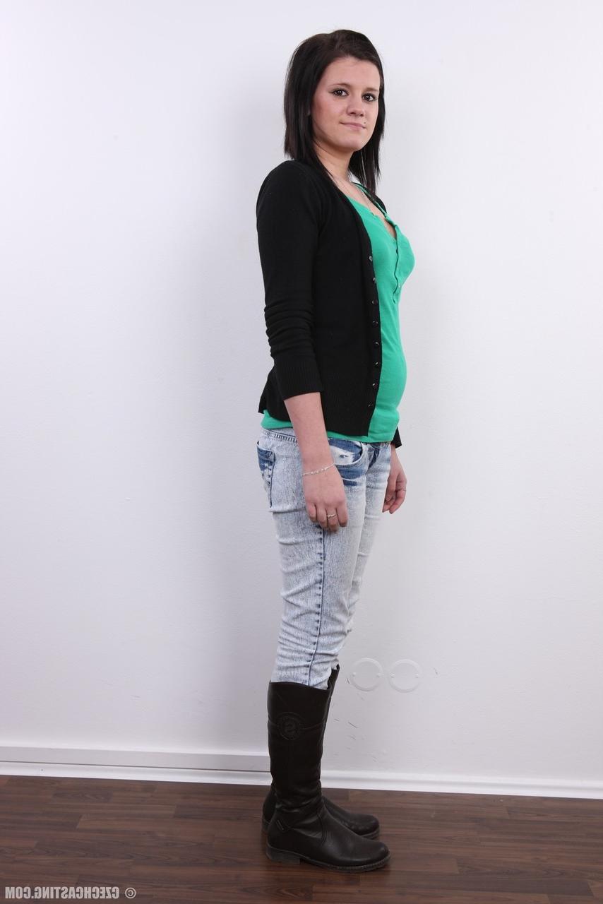 20P Cute brunette Lucie stands fully clothed before getting bare naked