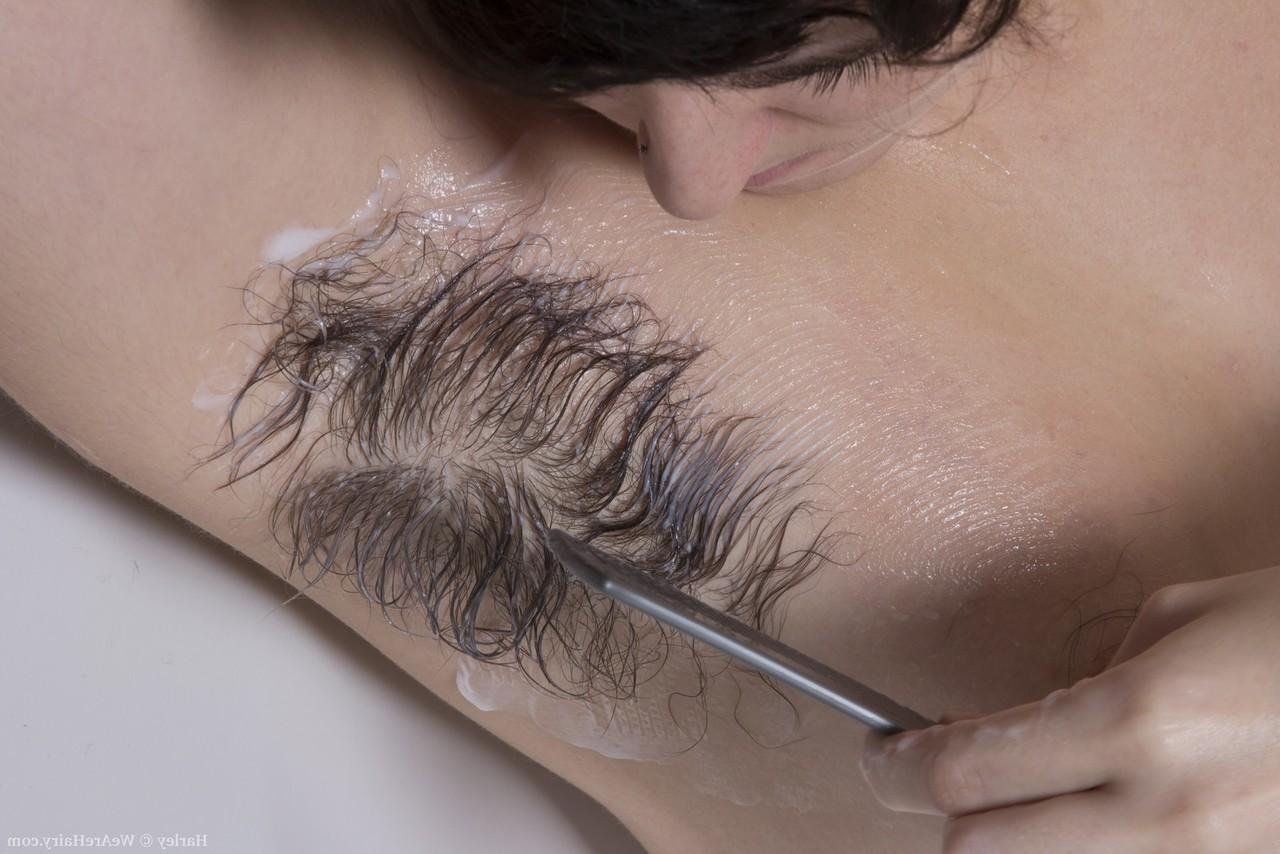 15P Hirsute woman Harley combs her wet underarms and legs in the bathtub