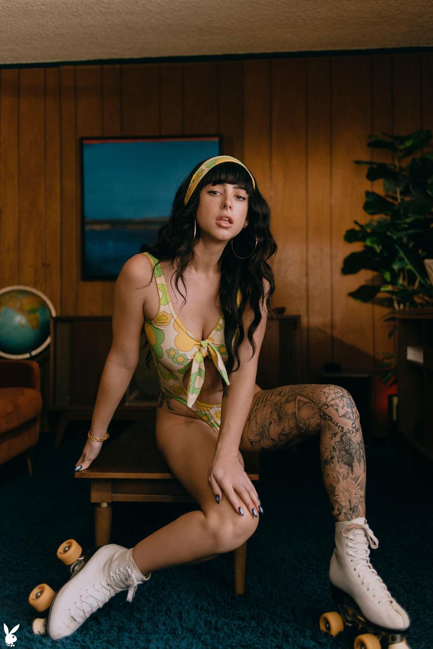 20P Glamorous raven-haired babe Reed poses naked on her roller skates