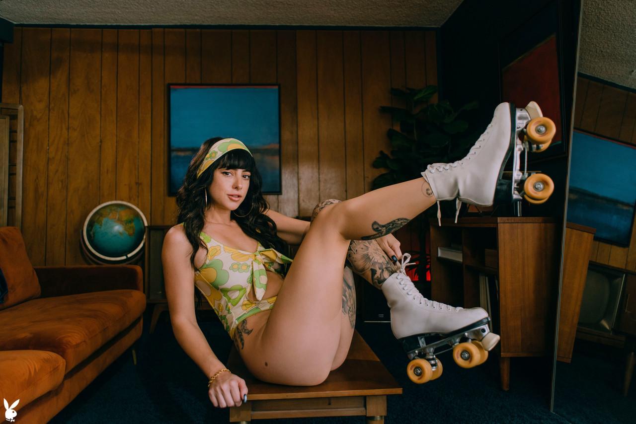 20P Glamorous raven-haired babe Reed poses naked on her roller skates